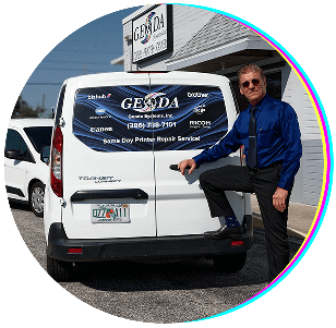 George, founder of Geoda Systems, standing by a van providing printer repair service in Palm Coast